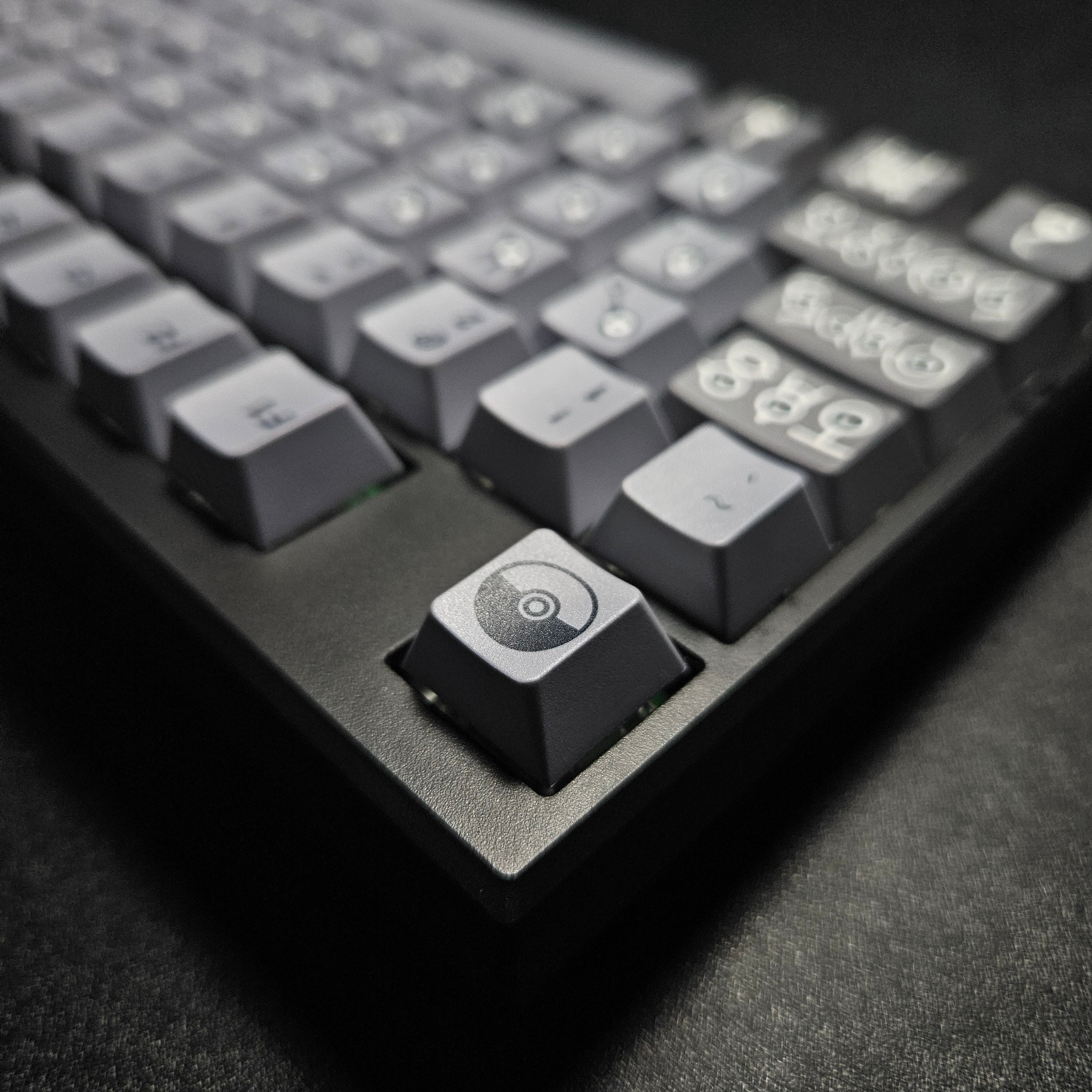 Unknown V2 keyboard close-up of gray and black themed keycaps with Unknown symbols