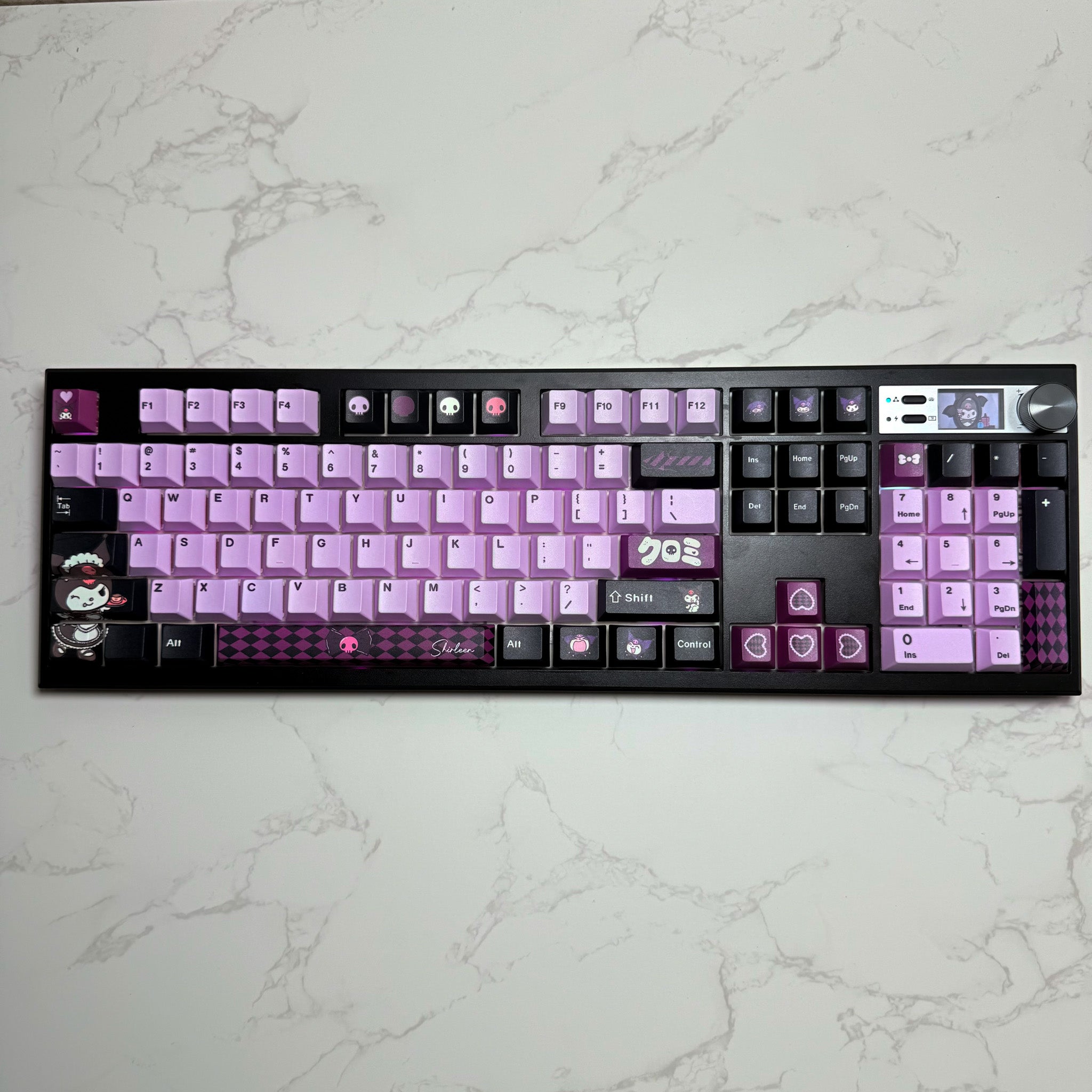 The Rebel V2 100% full-size custom mechanical keyboard with pink, purple, and black palette